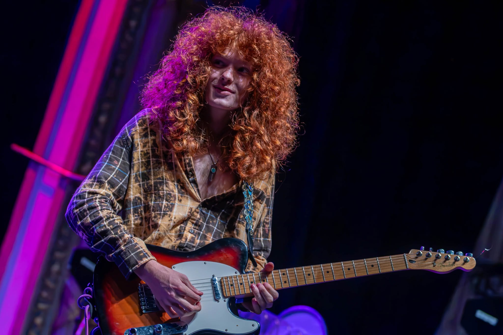 Jesse Bennett performing guitar during Taj Farrant's 2026 tour